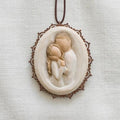 Embrace metal-edged ornament as a love keepsake gift