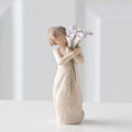 Beautiful Wishes figurine with flowers as a meaningful wishes gift